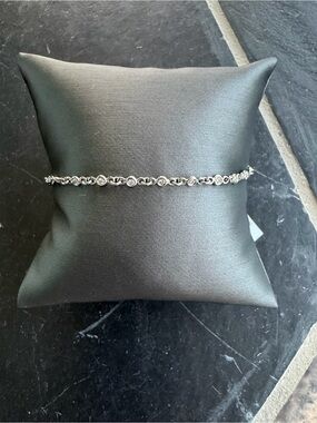 18kt. White Gold Tennis Bracelet with Diamonds bezel set 7” long